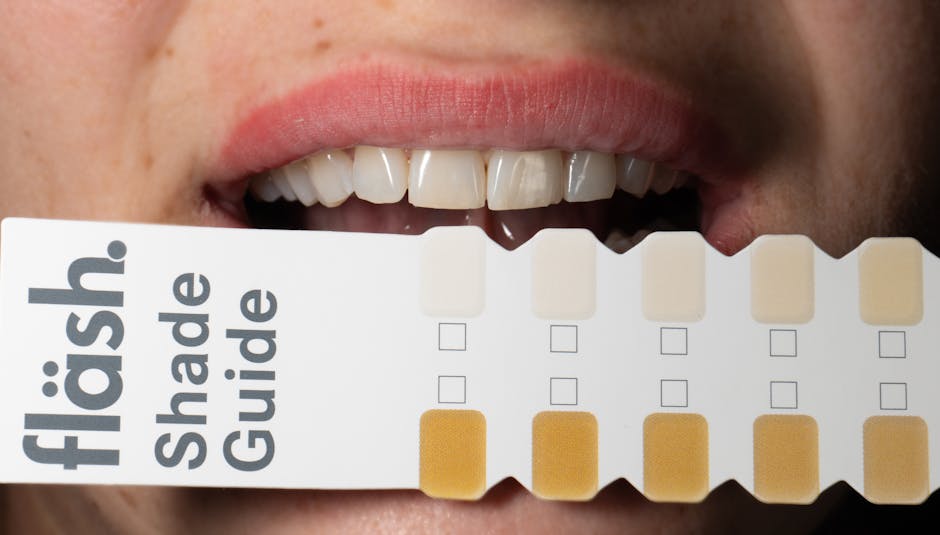 Smile held above a tooth shade guide